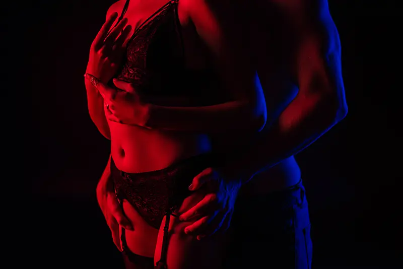 a man touches a sexy stripper